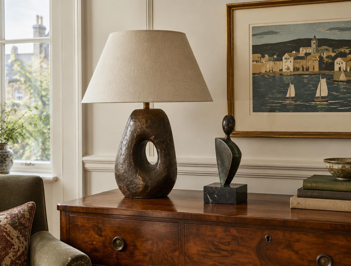 A distinctive sculptural lamp, small sculpture and framed print